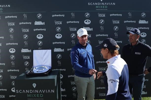 Jonathan Caldwell of Northern Ireland is congratulated by Annika Sorenstam and Henrik Stenson of Sweden after his win during the final round of The...