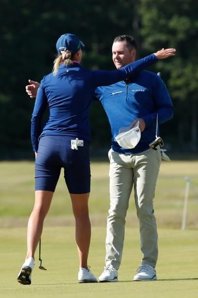 Jonathan Caldwell of Northern Ireland hugs Sanna Nuutinen of Finland on the 18th green during the final round of The Scandinavian Mixed Hosted by...