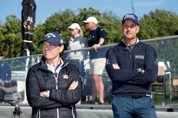 Henrik Stenson of Sweden looks on with Annika Sorenstam of Sweden by the 18th green during the final round of The Scandinavian Mixed Hosted by Henrik...