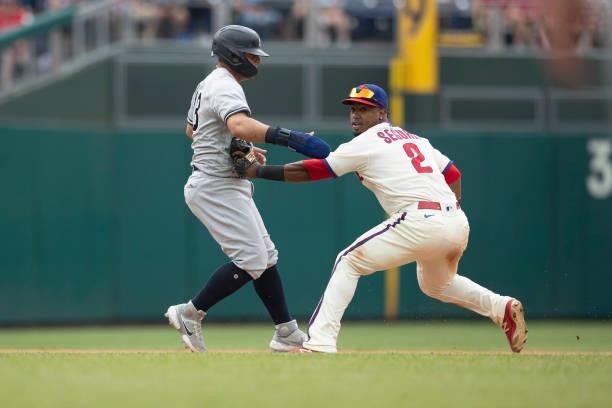 Jean Segura of the Philadelphia Phillies tags out Rougned Odor of the New York Yankees in a rundown in the top of the seventh inning at Citizens Bank...