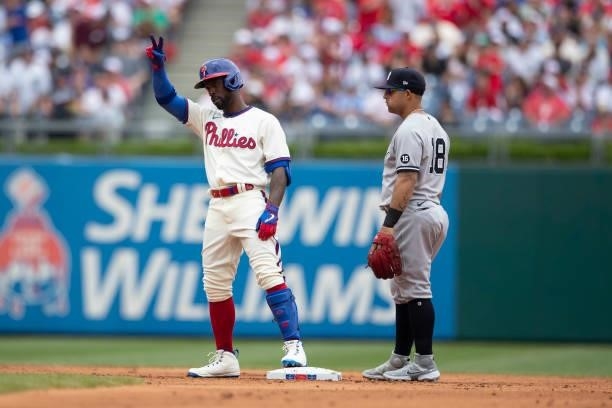 Andrew McCutchen of the Philadelphia Phillies reacts in front of Rougned Odor of the New York Yankees after a double in the bottom of the second...