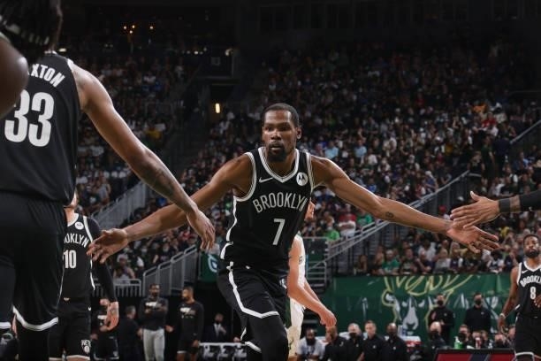 Kevin Durant of the Brooklyn Nets high fives during Round 2, Game 4 of the 2021 NBA Playoffs on June 13 2021 at the Fiserv Forum Center in Milwaukee,...