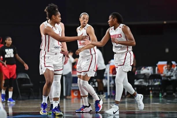 The Washington Mystics high five during the game against the Atlanta Dream on June 13, 2021 at Gateway Center Arena in College Park, Georgia. NOTE TO...