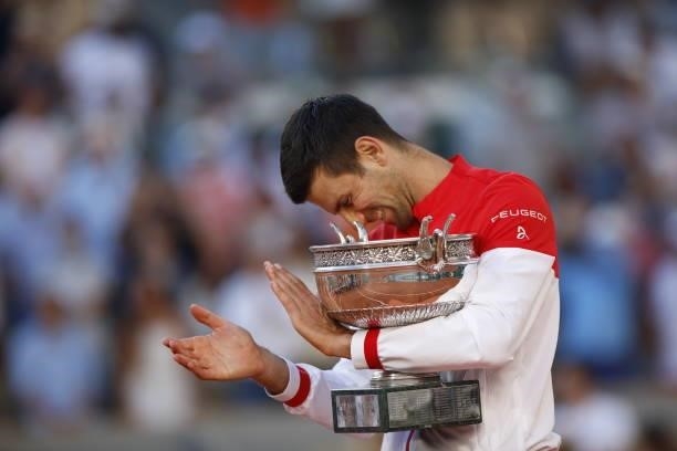 Winner Novak Djokovic of Serbia poses with trophy after defeating Stefanos Tsitsipas of Greece during their Men's final match at the French Open...