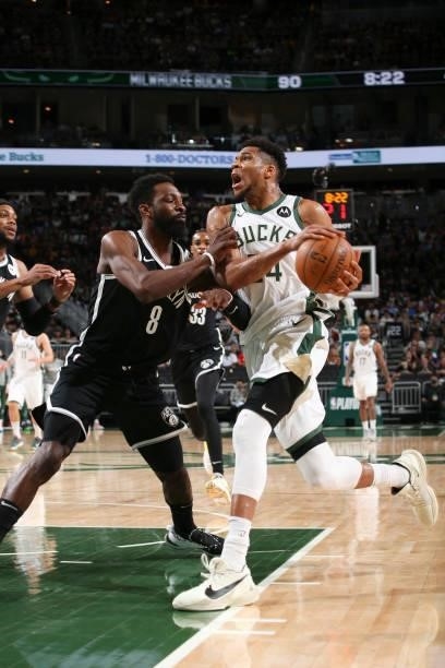 Giannis Antetokounmpo of the Milwaukee Bucks drives to the basket during the game as Jeff Green of the Brooklyn Nets plays defense during Round 2,...