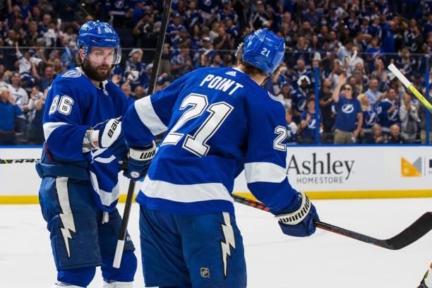 Brayden Point of the Tampa Bay Lightning celebrates his goal with teammates Nikita Kucherov against the New York Islanders during the third period in...