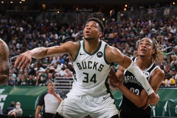 Giannis Antetokounmpo of the Milwaukee Bucks plays defense on Nicolas Claxton of the Brooklyn Nets during Round 2, Game 4 of the 2021 NBA Playoffs on...