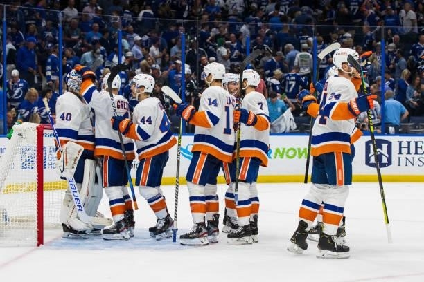 Goalie Semyon Varlamov of the New York Islanders celebrates the win with teammates against the Tampa Bay Lightning after Game One of the Stanley Cup...