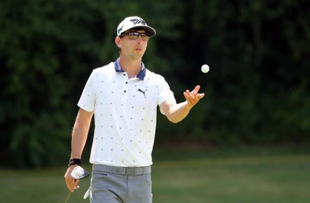 Seth Reeves toss his ball to his caddie on the eighth hole during the final round of the BMW Charity Pro-Am presented by Synnex Corporation at the...