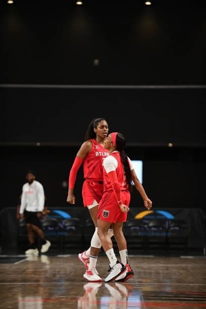 Cheyenne Parker of the Atlanta Dream celebrates with Odyssey Sims of the Atlanta Dream during the game on June 13, 2021 at Gateway Center Arena in...