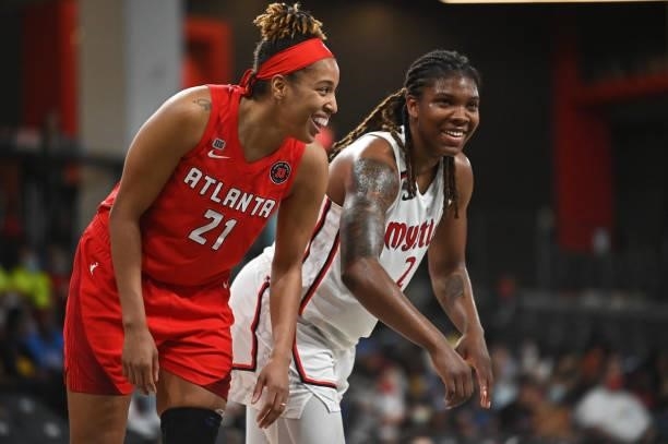 Tianna Hawkins of the Atlanta Dream laughs with Myisha Hines-Allen of the Washington Mystics during the game on June 13, 2021 at Gateway Center Arena...
