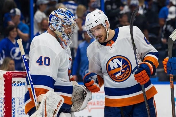 Goalie Semyon Varlamov of the New York Islanders celebrates the win with teammate Ryan Pulock against the Tampa Bay Lightning after Game One of the...
