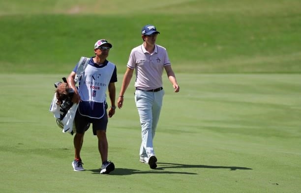 Nicolas Echavarria of Columbia and his caddie walk down the fairway on the eighth hole during the final round of the BMW Charity Pro-Am presented by...