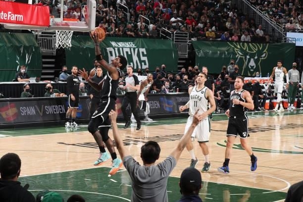 Kyrie Irving of the Brooklyn Nets drives to the basket against the Milwaukee Bucks during Round 2, Game 4 of the 2021 NBA Playoffs on June 13 2021 at...