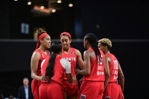 The Atlanta Dream huddle up during the game against the Washington Mystics on June 13, 2021 at Gateway Center Arena in College Park, Georgia. NOTE TO...