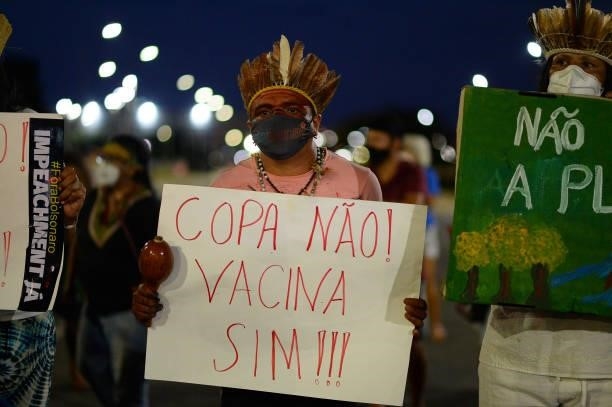 Indigenous people protest Copa America and the lack of vaccines for coronavirus on June 13, 2021 in Brasilia, Brazil. Brazil, through President Jair...