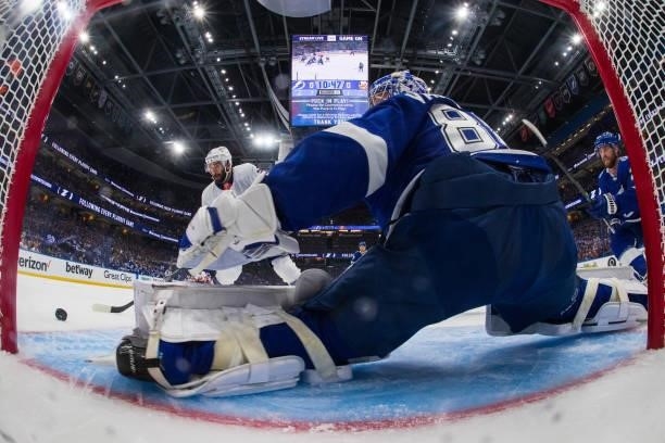 Goalie Andrei Vasilevskiy of the Tampa Bay Lightning stretches to make a save against Kyle Palmieri of the New York Islanders during the first period...