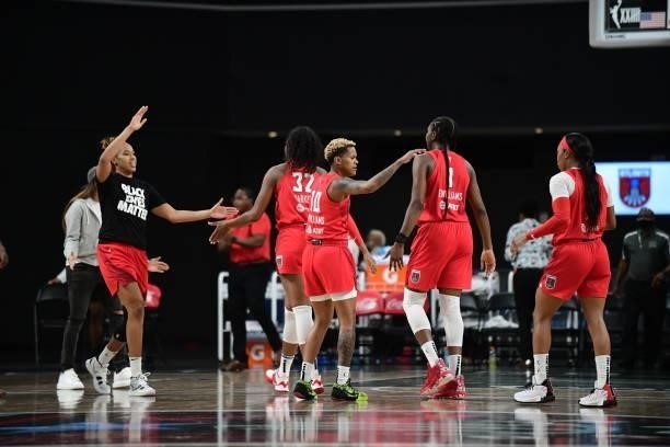The Atlanta Dream high five during the game against the Washington Mystics on June 13, 2021 at Gateway Center Arena in College Park, Georgia. NOTE TO...