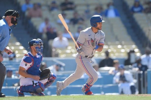 Jason Martin of the Texas Rangers hits a one run single against relief pitcher Kenley Jansen of the Los Angeles Dodgers during the ninth inning of a...