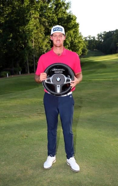 Mito Pereira of Chile holds the championship trophy after winning the BMW Charity Pro-Am presented by Synnex Corporation at the Thornblade Club on...