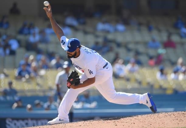 Relief pitcher Kenley Jansen of the Los Angeles Dodgers throws against the Texas Rangers during the ninth inning of their inter-league game at Dodger...