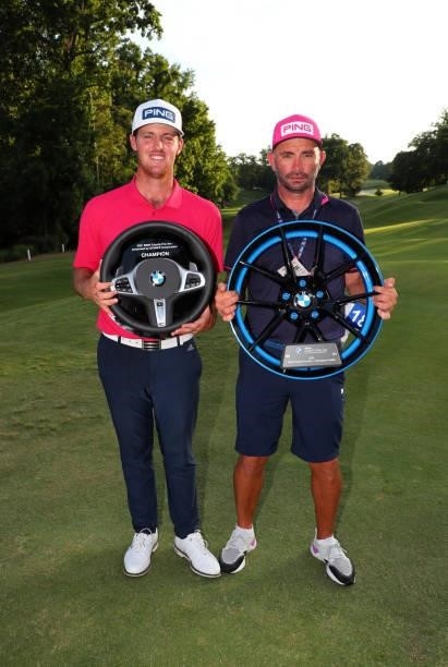 Mito Pereira of Chile stands with his caddie Nany Pereyra as they hold their trophies after winning the BMW Charity Pro-Am presented by Synnex...