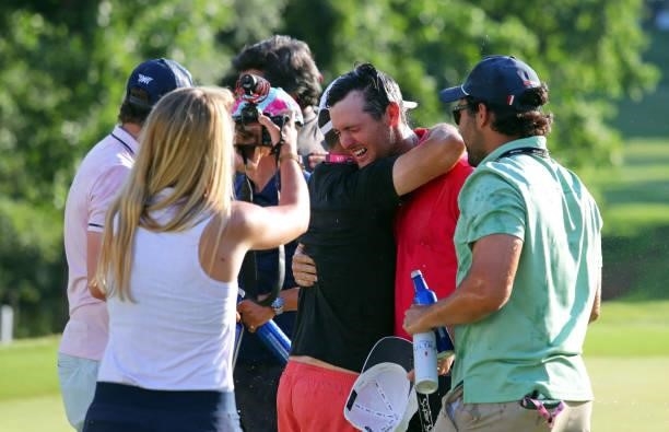Mito Pereira of Chile reacts as he is swarmed by friends on the 18th green after winning the BMW Charity Pro-Am presented by Synnex Corporation at...