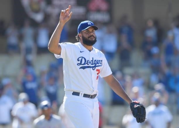 Relief pitcher Kenley Jansen of the Los Angeles Dodgers celebrate after the last out of the game against Texas Rangers and making his career 327th...