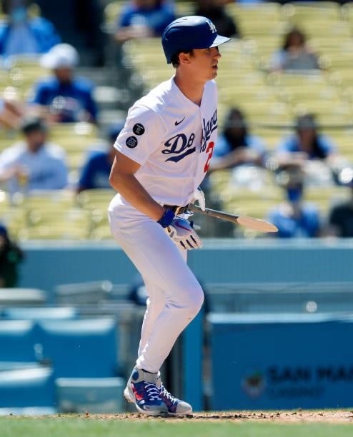 Starting pitcher Walker Buehler of the Los Angeles Dodgers breaks his bat during the fourth inning against the Texas Rangers during an inter league...