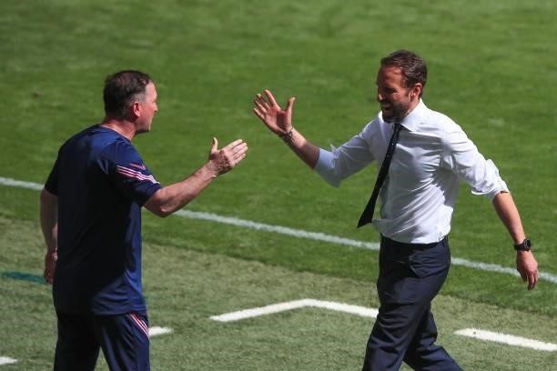 Gareth Southgate, Head Coach of England celebrates the win with assistant Steve Holland during the UEFA Euro 2020 Championship Group D match between...