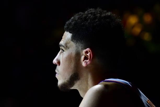 Devin Booker of the Phoenix Suns looks on during Round 2, Game 4 of the 2021 NBA Playoffs on June 13, 2021 at the Ball Arena in Denver, Colorado....