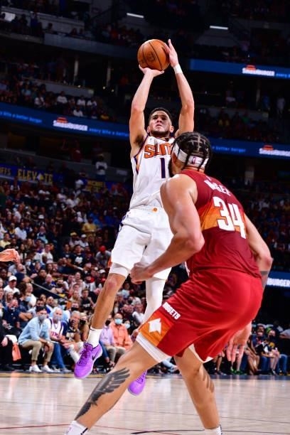 Devin Booker of the Phoenix Suns shoots the ball against the Denver Nuggets during Round 2, Game 4 of the 2021 NBA Playoffs on June 13, 2021 at the...