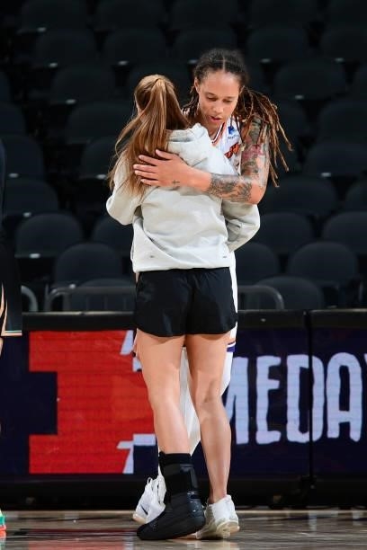 Brittney Griner of the Phoenix Mercury hugs Sabrina Ionescu of the New York Liberty after the game on June 13, 2021 at Phoenix Suns Arena in Phoenix,...