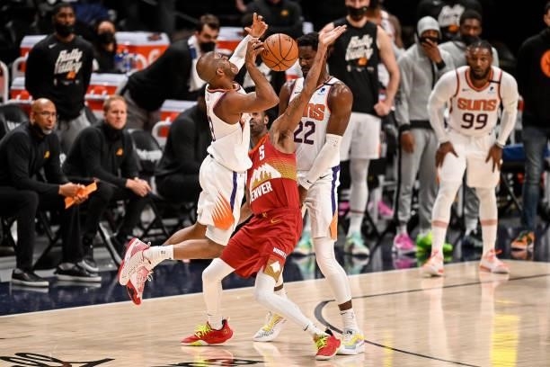 Chris Paul of the Phoenix Suns draws a foul by Will Barton of the Denver Nuggets in Game Four of the Western Conference second-round playoff series...