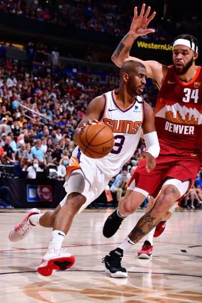 Chris Paul of the Phoenix Suns dribbles the ball during Round 2, Game 4 of the 2021 NBA Playoffs on June 13, 2021 at the Ball Arena in Denver,...
