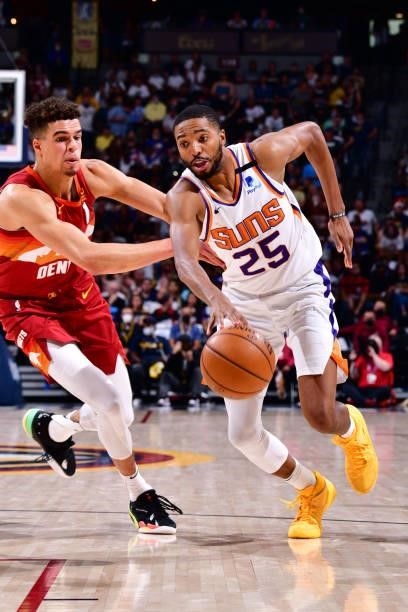Mikal Bridges of the Phoenix Suns dribbles the ball during Round 2, Game 4 of the 2021 NBA Playoffs on June 13, 2021 at the Ball Arena in Denver,...
