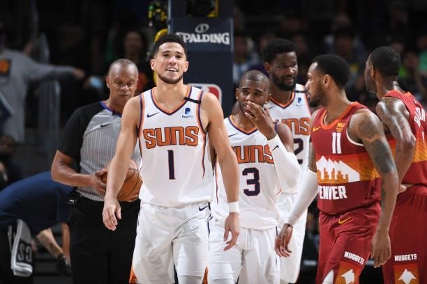 Devin Booker of the Phoenix Suns smiles during the game against the Denver Nuggets during Round 2, Game 4 of the 2021 NBA Playoffs on June 13, 2021...