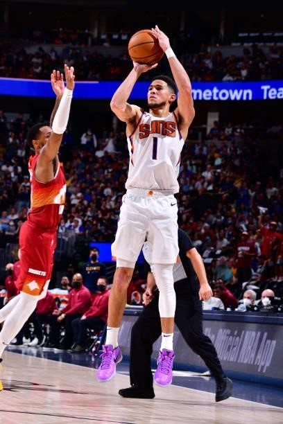 Devin Booker of the Phoenix Suns shoots the ball against the Denver Nuggets during Round 2, Game 4 of the 2021 NBA Playoffs on June 13, 2021 at the...