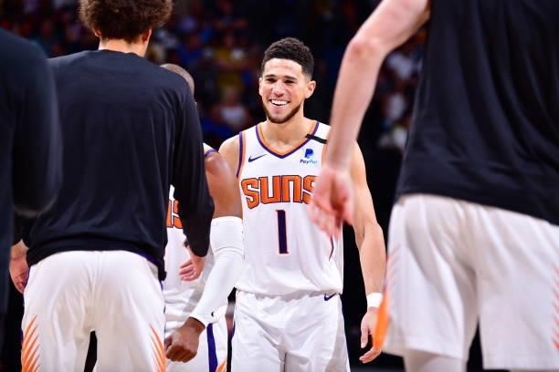 Devin Booker of the Phoenix Suns smiles during Round 2, Game 4 of the 2021 NBA Playoffs on June 13, 2021 at the Ball Arena in Denver, Colorado. NOTE...