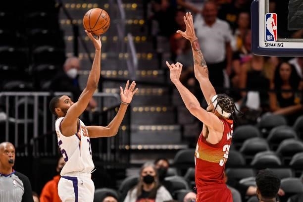 Mikal Bridges of the Phoenix Suns shoots past JaVale McGee of the Denver Nuggets for two points in Game Four of the Western Conference second-round...