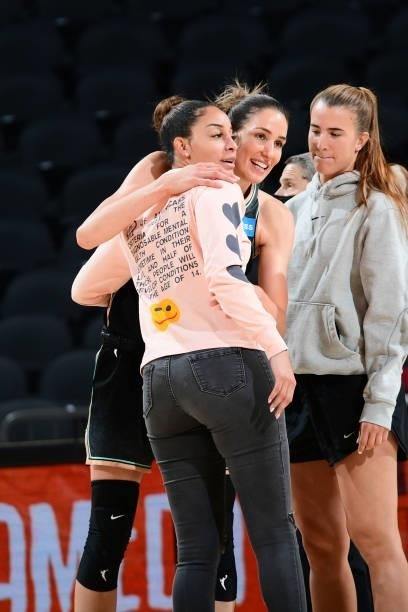 Rebecca Allen of the New York Liberty hugs Bria Hartley of the Phoenix Mercury after the game on June 13, 2021 at Phoenix Suns Arena in Phoenix,...