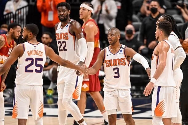 Chris Paul of the Phoenix Suns is congratulated after a fourth-quarter free throw against the Denver Nuggets in Game Four of the Western Conference...