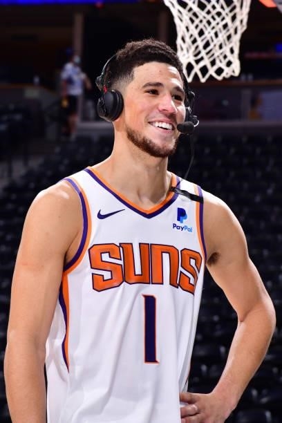Devin Booker of the Phoenix Suns is interviewed after the game against the Denver Nuggets during Round 2, Game 4 of the 2021 NBA Playoffs on June 13,...