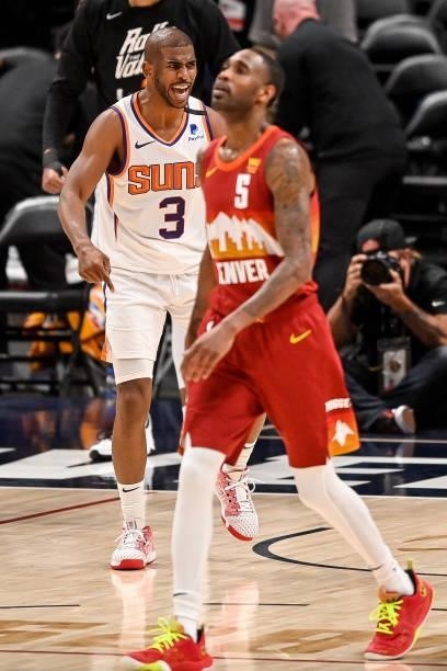 Chris Paul of the Phoenix Suns celebrates towards Will Barton of the Denver Nuggets after scoring off a turnover in Game Four of the Western...