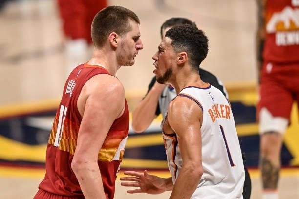 Nikola Jokic of the Denver Nuggets gets in the face of Devin Booker of the Phoenix Suns after a play that would result in Jokic's ejection in Game...