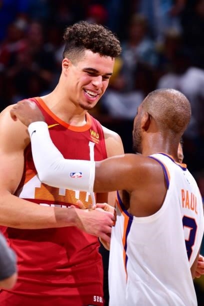 Michael Porter Jr. #1 of the Denver Nuggets hi-fives Chris Paul of the Phoenix Suns after the game during Round 2, Game 4 of the 2021 NBA Playoffs on...