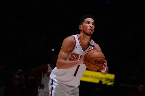 Devin Booker of the Phoenix Suns shoots a free throw against the Denver Nuggets during Round 2, Game 4 of the 2021 NBA Playoffs on June 13, 2021 at...