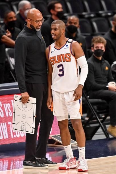 Head coach Monte Williams of the Phoenix Suns has a word with Chris Paul during action against the Denver Nuggets in Game Four of the Western...