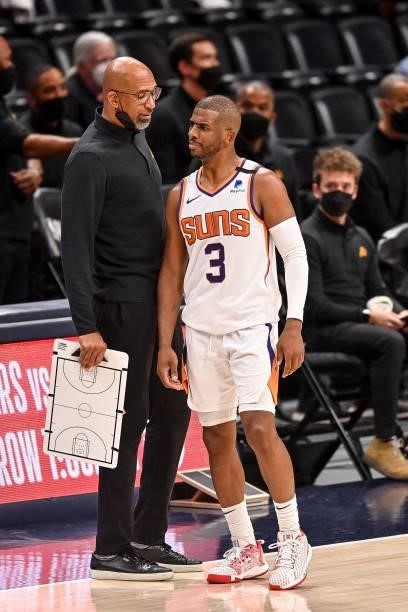 Head coach Monte Williams of the Phoenix Suns has a word with Chris Paul during action against the Denver Nuggets in Game Four of the Western...