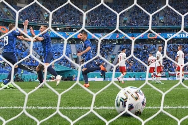Slovakia's defender Milan Skriniar celebrates with teammates after scoring his team's second goal during the UEFA EURO 2020 Group E football match...